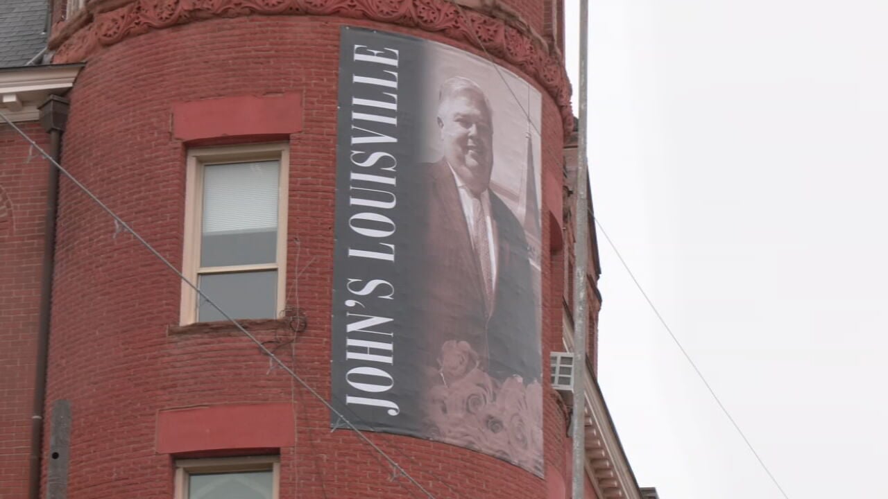 Louisville honors the late John Asher with Hometown Hero banner at school he championed
